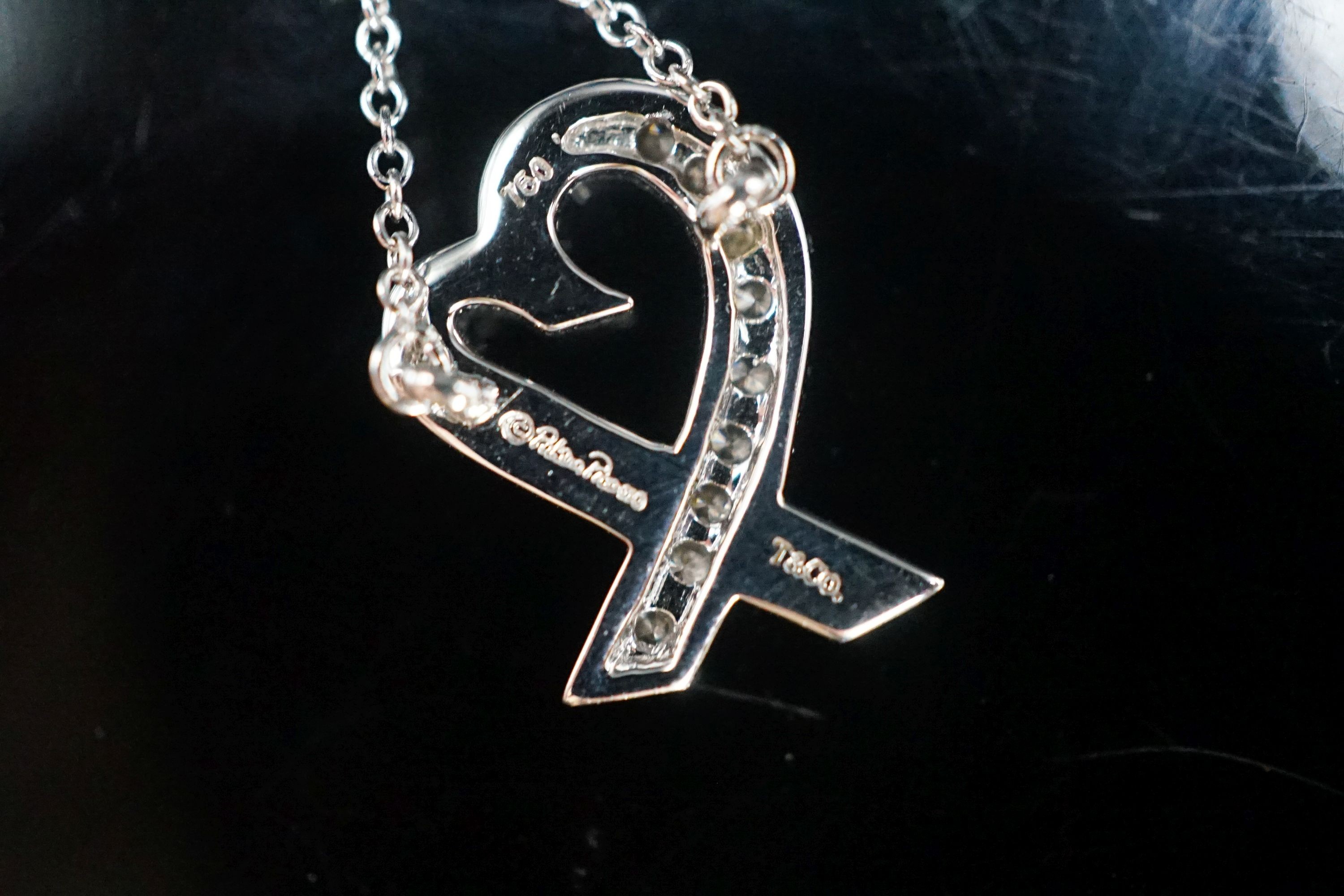A modern Paloma Picasso for Tiffany & Co 750 white metal and diamond set loving heart pendant necklace, pendant 15mm, gross weight 2.9 grams, with Tiffany & Co box.